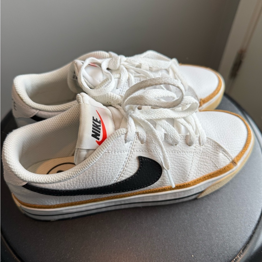 Nike Kids White and Black Sneakers with Gold Accents